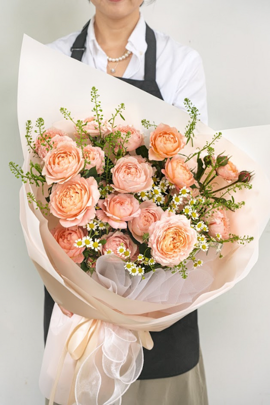 Person holding a bouquet